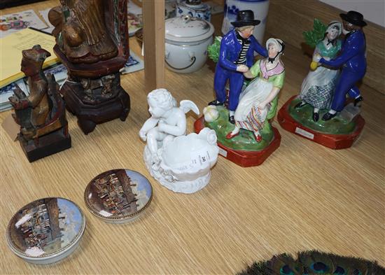 A pair of Departure and Return pearlware figures, two Prattware pot lids and a porcelain cherub dish